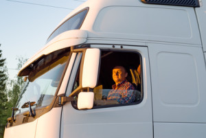 The driver in a cabin of the truck